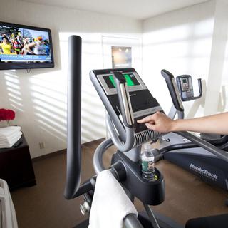 Granzella’s Inn | Williams, California | Treadmill and TV in white room